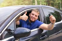 happy-driver-young-man-driving-his-car-show-keys-smiling-show-thumb-up-like-from-automobile-window_1